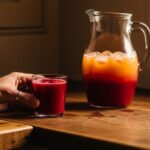 Beetroot juice tasting moment with labeled jug