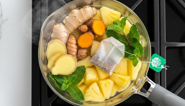 costa rican tea ingredients simmering in pot