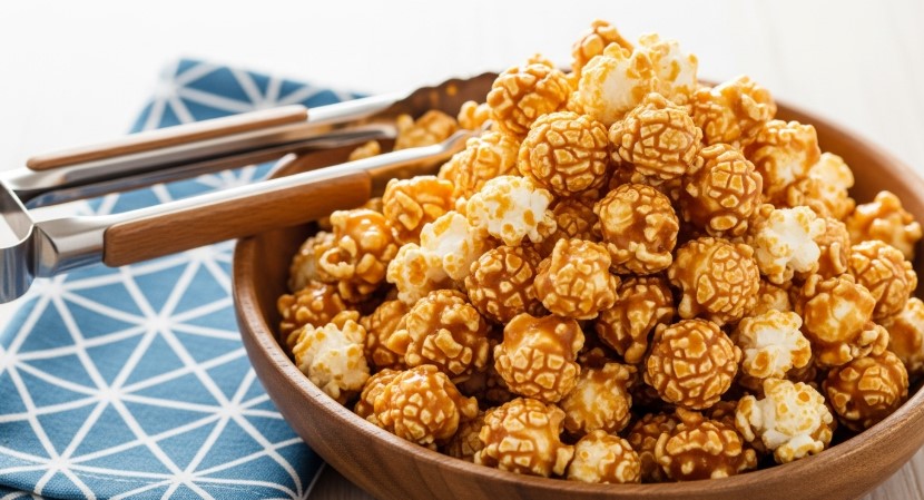 finished caramel popcorn in a wooden bowl
