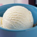Freshly creamed vanilla Ninja Creami ice cream in a blue bowl
