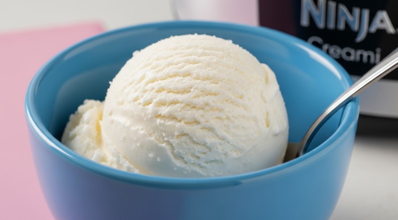 Freshly creamed vanilla Ninja Creami ice cream in a blue bowl