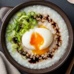 Asian-style congee with scallions and egg