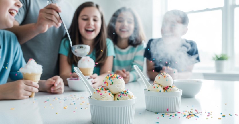 Family enjoying homemade snow ice cream on a snow day