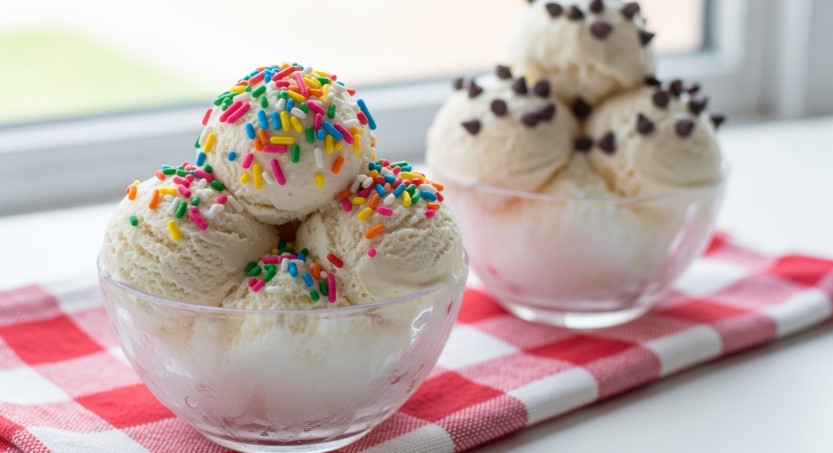 Scoops of homemade snow ice cream with toppings